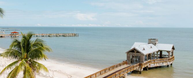 Oceanfront gazebo overlooking the natural sand beach at The Reach Key West with turquoise water views